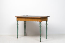Swedish folk art table from the around the 1850s. The table is a slightly different model where the table top can be folded up