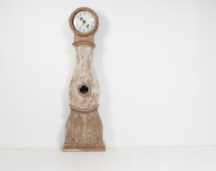 Classic long case clock in rococo from Sweden made around the early to mid 19th century, 1820 to 1840. The clock is painted pine