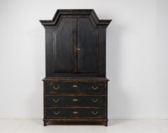 Folk art country cabinet from northern Sweden made during the early to mid 1800s, around 1820 to 1840. The cabinet is made in two parts