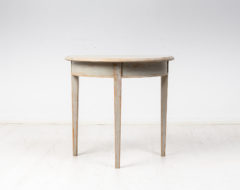 Small demi lune table made in pine from Northern Sweden. This demi lune table is from the mid 1800s, around 1850 to 1860, and is unusually small