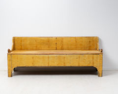 Antique folk art bench from northern Sweden made around 1850 to 1860. The bench has charming faux paint that imitates birch.