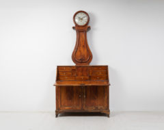 Swedish antique clock cabinet made during the early to mid 1800s, circa 1820 to 1840. The cabinet is veneered and waxed elm.