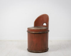 Antique Swedish stump chair in folk art. The chair has a round shape and is made from a hollowed pine tree stump. The chair is in untouched condition