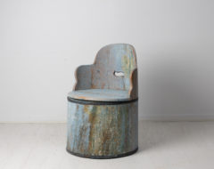 Antique Swedish stump chair in folk art. The chair is made from a single piece of wood, a pine log that's been hollowed out by hand.