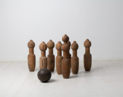 Swedish antique bowling set from the mid 19th century, around 1850. The set, a skittles or ninepins game as it's also known, has nine pins in pine and one ball.