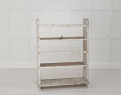 Swedish antique wall shelf in folk art from northern Sweden. The shelf is made around 1850 and is wonderfully rustic with time worn distress and patina