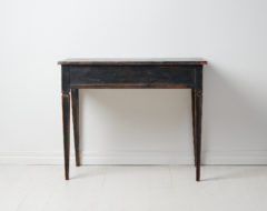 Antique Swedish console table in gustavian style made in Sweden during the early 1800s, around 1810. Made in pine with distressed black paint