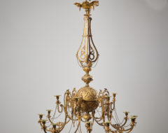 Antique Swedish bronzed chandelier made during the mid 1800s, around 1850 to 1860. The chandelier is made in bronzed metal with a richly decorated round frame