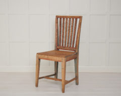 Swedish folk art chair in gustavian style in pine made during the early 1800s, around 1820. The chair has been standing in the same farm house