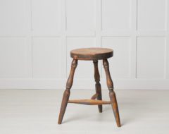 Antique Swedish country stool in folk art made with three legs. This stool is from northern Sweden and made around the 1860s