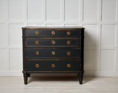 Antique Swedish gustavian commode made during the late 18th century, around 1790. The commode has 4 drawers and slanted corners.