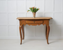 Rare antique baroque table from Sweden made during the mid to late 1700s, around 1770. The table is a wall table and is made in pine