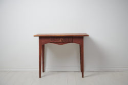 Charming folk art table with straight legs, a drawer and curved apron. The table is completely untouched with the authentic patina