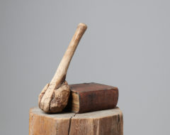 Antique hand-made wooden club in folk art made during the mid 1800s. The club is made by hand from a branch with a burl at the end