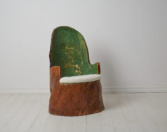 Antique Swedish "Kubbstol" or "Stockstol" as they are also known. The chair is a primitive furniture made by hand from one large, solid log of wood