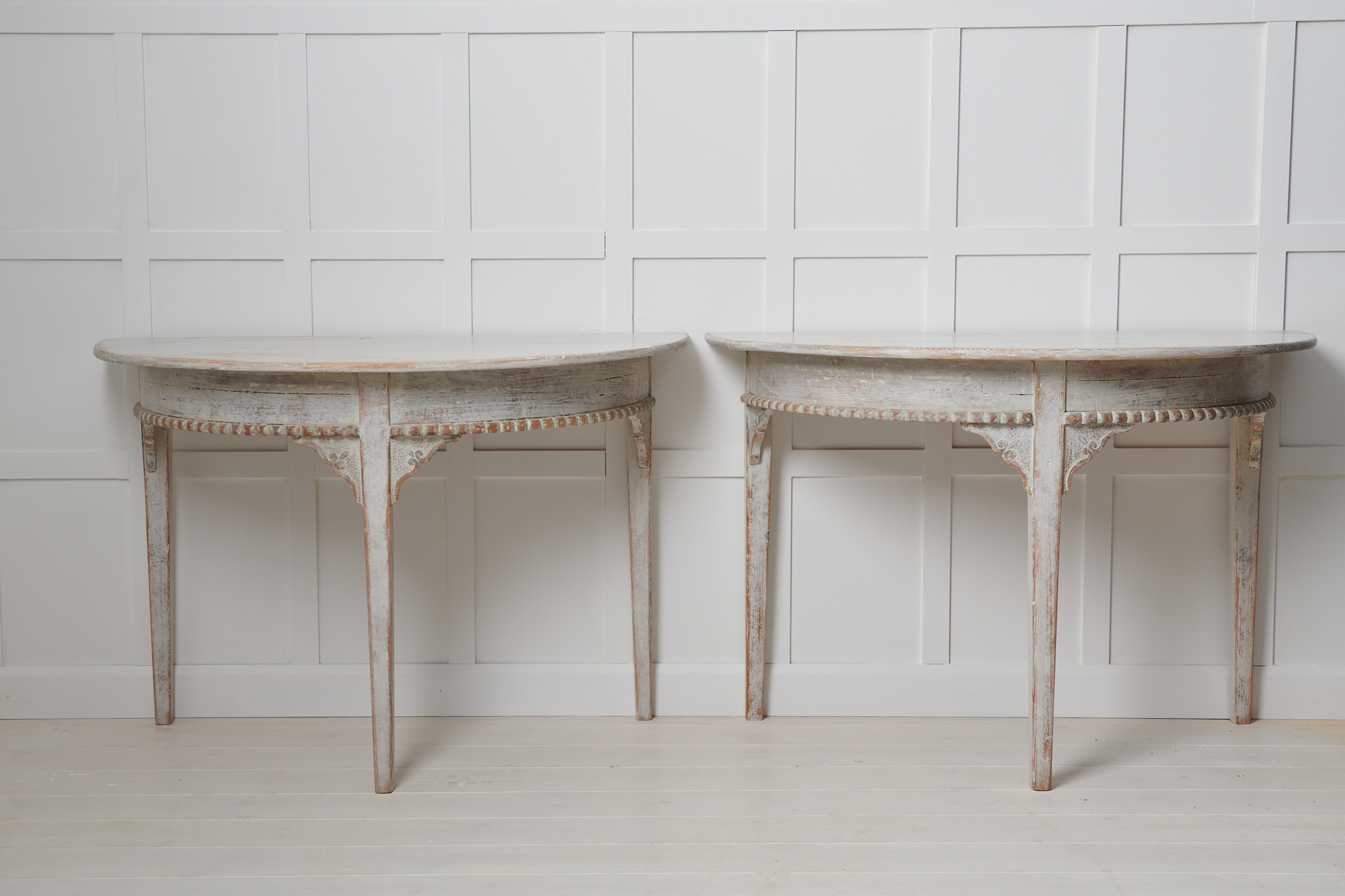 Antique demi lune table in gustavian style from Sweden. The table is a country furniture from around the 1840s and is made in two halves