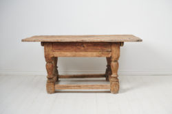 Unique Swedish baroque table made by hand during the mid 1700s. The table is a very rare example of early Swedish furniture and has a frame in pine with heavy, solid lathed legs.