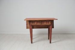 Small charming country table from northern Sweden. The table is a genuine folk art furniture from around 1790 to 1810. It is made by hand in solid pine