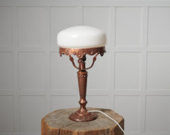 Swedish art nouveau light from the 1920s. The table light has a base made by hand in solid brass with decor. The shade is round