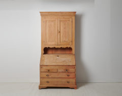 antique Swedish secretary cabinet in gustavian style. The cabinet is made in northern Sweden around the 1820s. The cabinet is a well crafted piece in two parts made by hand in solid pine.