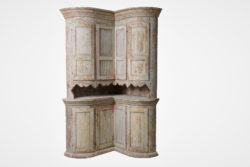 Unusual antique corner cabinet from Sweden. The cabinet is made in two parts and has a very unusual model with a curved serpentine front with 4 + 4 doors.