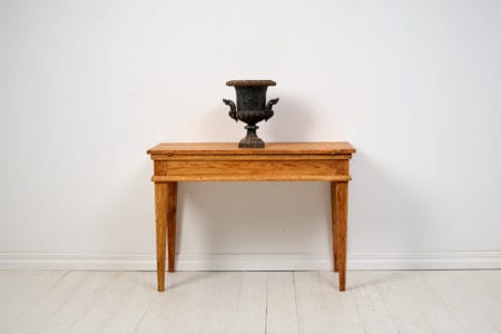 Antique country console table in Gustavian style. All four sides are the same, making it suitable as a freestanding table as well