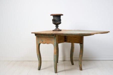 Antique Rococo drop-leaf table from Sweden, crafted around 1770. The surface is uniquely rustic with an attractive distress after 250 years