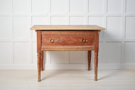 Antique Swedish country table dated 1860. The table is a genuine country house furniture that has been dry scraped by hand to the first layer of paint