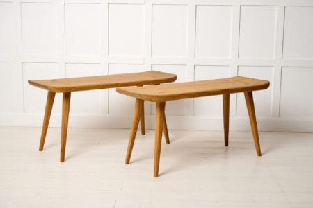 Swedish Modern benches Visingsö by Carl Malmsten. The two benches are from the mid 20th century and made in solid pine stained with