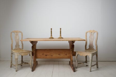 Swedish antique dining table or work table. The table is a genuine trestle table from northern Sweden made around 1820. The table has a large solid table top on a leg frame with bevelled trestles.