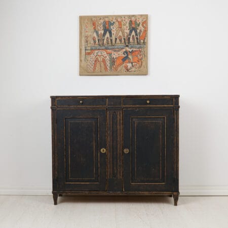 Swedish country antique sideboard from the gustavian period during the late 1700s. The sideboard has a classic straight shape with two doors