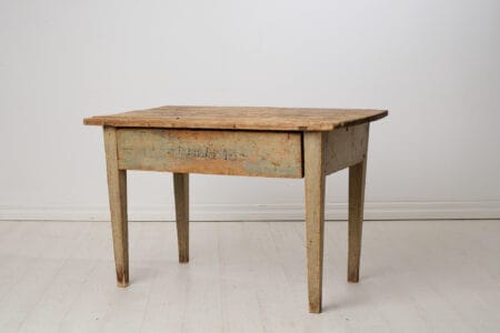 Rustic farm house table from northern Sweden made by hand in solid pine. The table is from around the 1840s and is in untouched original condition.