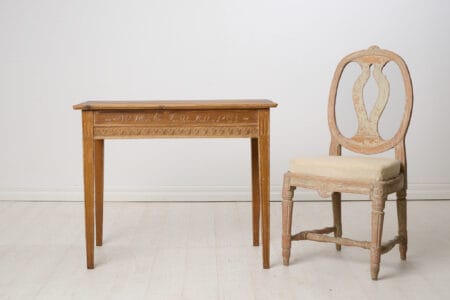 Antique console table in gustavian style dated September 24th 1852. Straight tapered legs, apron with period-typical gustavian carved leaves.