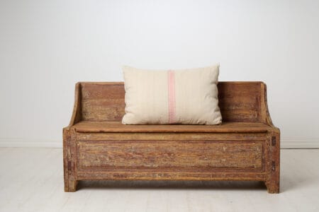 Primitive antique rustic bench in folk art from northern Sweden. Made by hand with a frame in solid pine around 1820 to 1840.