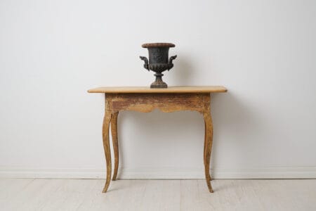 Genuine antique rococo table from northern Sweden. The table rectangular and the same from both sides. From the rococo period around 1770.