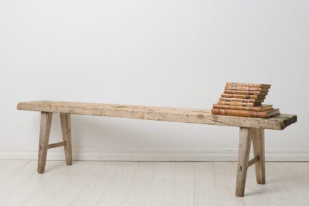 Rustic primitive bench from the early 1800s. Made by hand in solid pine in northern Sweden around 1830. The seat is made from just one board