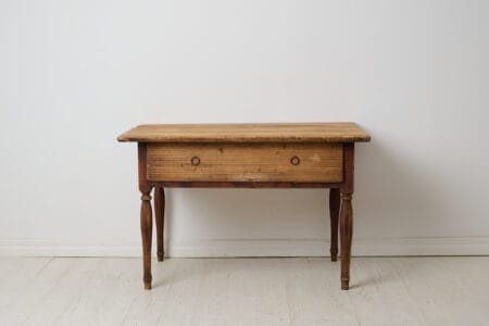 Genuine antique country table from the empire period around 1830. The table is made by hand from solid pine in northern Sweden.
