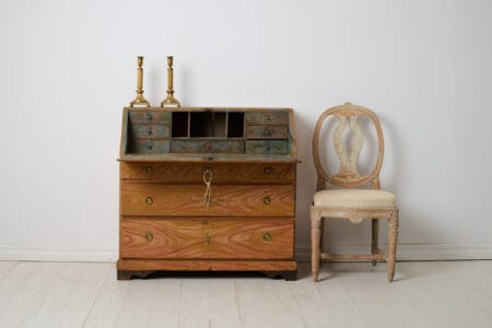 Genuine folk art secretary desk from the early 1800s. Made by hand in solid pine with the original first layer of paint from the 1820s.