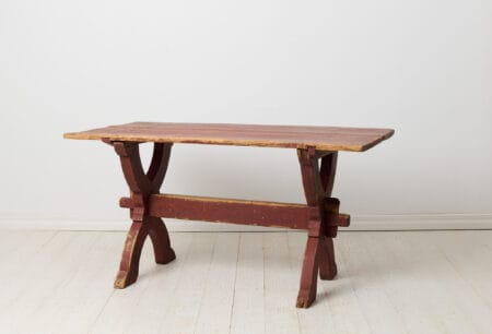 Early 19th century dining table or work table from Sweden. This antique table is a genuine trestle table from northern Sweden made around 1820.