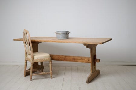 Antique Swedish dining table or work table from the 1840s. Trestle table made by hand in solid pine in northern Sweden.