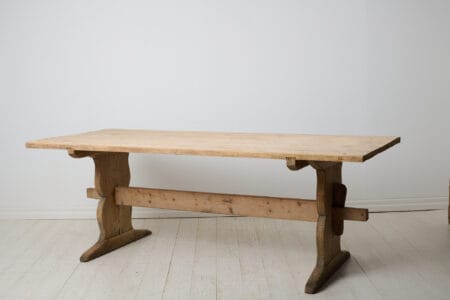 Large Swedish trestle table from the 1840s. This table is an authentic antique and would work well as either a dining or work table.