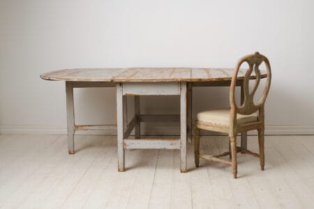 Large drop leaf table made by hand in solid pine during the mid 1800s in northern Sweden, circa 1850 to 1860.