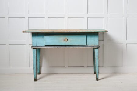 Folk art turquoise table from the 1800s. This antique table is made in northern Sweden around 1850. Classic gustavian straight shape