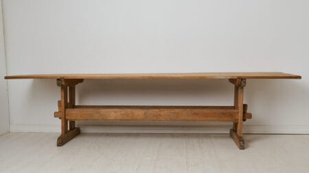 Large trestle dining table from northern Sweden. Made by hand in solid pine around 1860. The table top and the leg frame are an original pair