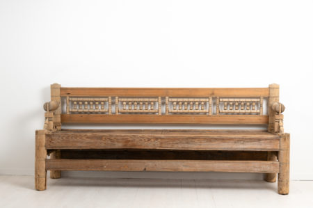 Early Swedish pine bench from northern Sweden. The bench is a very early version of a seat or sofa and this one also has a reversible backrest