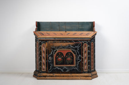 Unusual folk art sideboard from Hälsingland in Sweden made during the early 1800s, around 1820 to 1830. The sideboard is painted pine