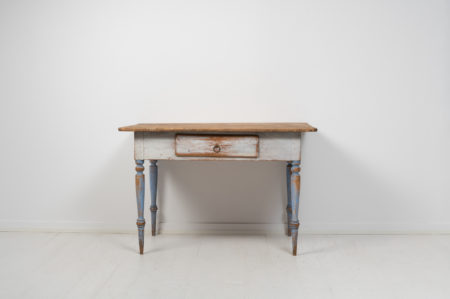 Small folk art table from northern Sweden made around 1850. The table is painted pine with the original first layer of paint that has the authentic patina of time