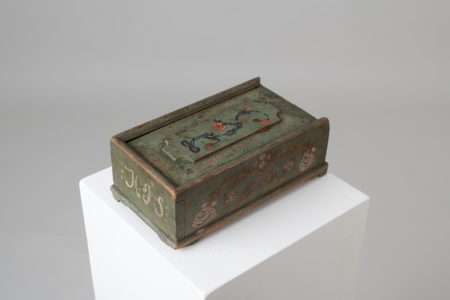 Antique box with siding lid in folk art. The box has the original decoration paint and the dating 1798 as well as a monogram