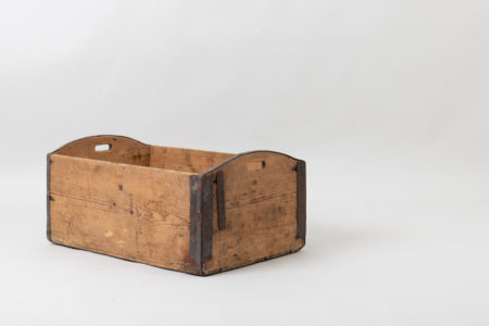 Wooden box in never painted pine. Used for storage in households with enforcements in iron. Made during the late 1800s. Branded with a monogram on one side.