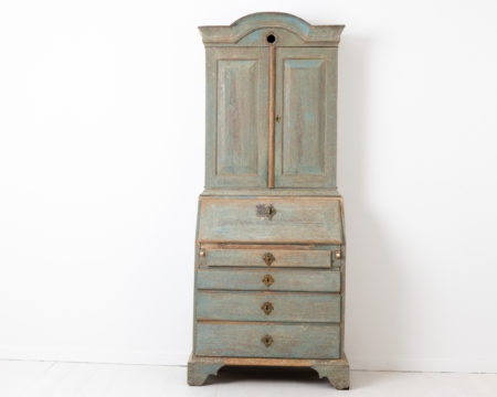 Blue rococo cabinet with desk top from Sweden. The cabinet is from the mid 1700s and made from oak and dry scraped by hand to the original blue paint